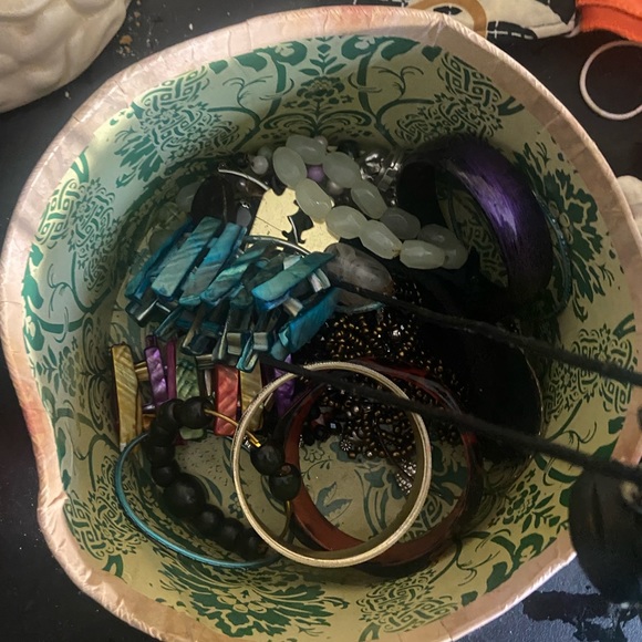 A bunch of bracelets with basket over 35 in the box